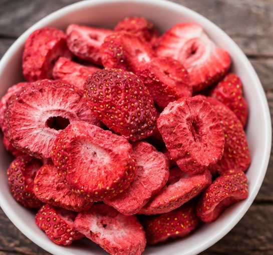 Bowl of freeze-dried strawberries, an example of finished freeze-dried output